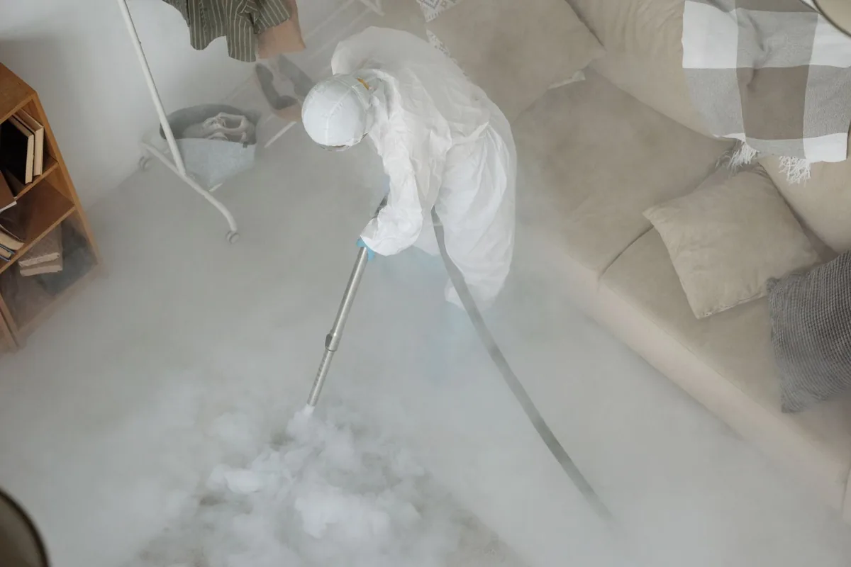 Biohazard cleanup technician in protective equipment, West Babylon, NY